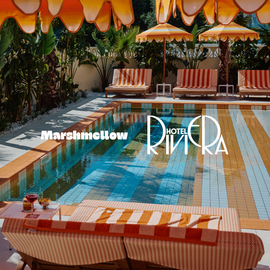 A resort-style swimming pool surrounded by orange and cream striped lounge chairs, umbrellas, and tropical plants. Large overlaid text reads 'Marshmellow' and 'Hotel Rina Ra'.